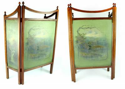An Edwardian mahogany three-fold fire screen, each panel with hand painted woodland scene, the smaller panels with waterfalls to centre, unsigned, height 82cm, height of each panel 50cm.