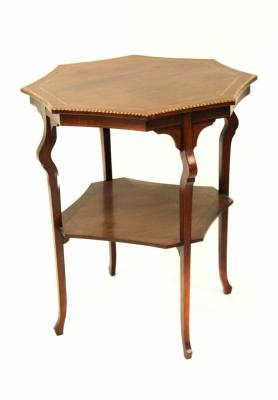 An Edwardian mahogany inlaid occasional table with shaped top above four square tapering legs united by undertier.