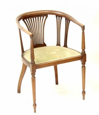 An Edwardian mahogany inlaid tub chair with slatted back splats and sides, with upholstered seats.