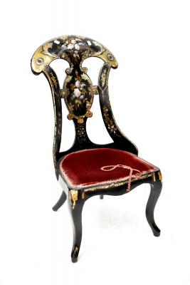 A Victorian papier mâché black lacquered, hand painted and mother of pearl inlaid chair (af).