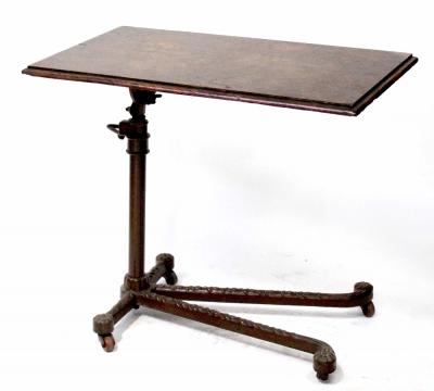 A 19th century oak and cast iron adjustable reading table, 74 x 44cm.