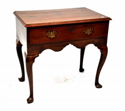 A Georgian mahogany lowboy with single drawer with brass drop handles above a shaped frieze, on cabriole legs to pad feet, 71 x 76 x 50cm.