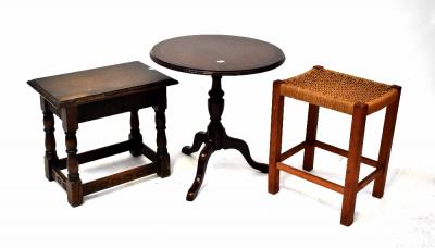An 18th century style oak joint stool, a Regency-style circular-topped occasional table and a wicker-topped stool (3).