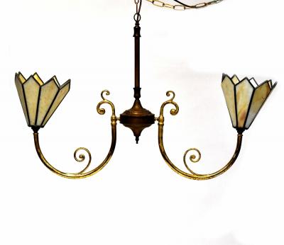 A brass and gilt metal twin-branch light fitting with scroll arms and octagonal cream leaded glass shades, width 100cm.