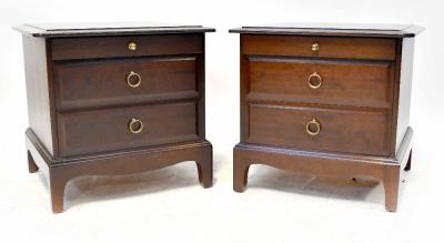 A pair of Stag Minstrel bedside tables, each with two drawers with ring handles, on bracket feet, 50 x 50 x 47cm.