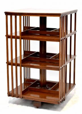 An Edwardian mahogany revolving bookcase with square top and three tiers, on a turned column and wooden base, 93 x 55 x 55cm.