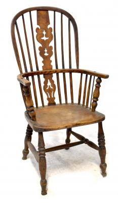 A late 18th/early 19th century high-back Windsor chair, with Christmas tree splat, turned and straight supports, one-piece seat, triple ringed turned forelegs and H-frame stretcher.