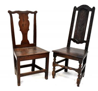 A late 17th/early 18th century carved oak high back hall or side chair, the splat carved with a large vertical feather, the side uprights and domed top rail carved with repeating flower heads and scrolls, the solid seat above turned front supports united with turned front stretcher and double side stretchers, on pad feet, also a late 18th century side chair with vase-shaped splat,  shaped top rail, solid seat and square supports united with straight stretchers (2).
