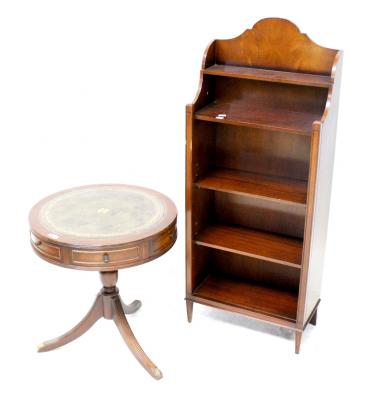 A reproduction mahogany drum table with tooled leather insert to top and two frieze drawers with four dummy drawers, on tripod base, height 53cm, diameter 50cm and a modern mahogany floor standing bookcase of five shelves, height 114cm (2).