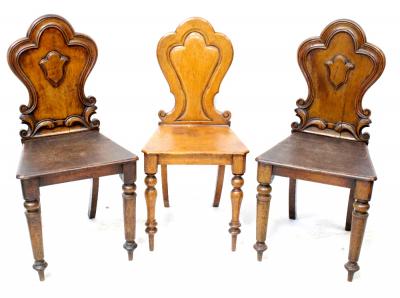 Three Victorian shield back hall chairs with tapering turned supports to peg feet (3).