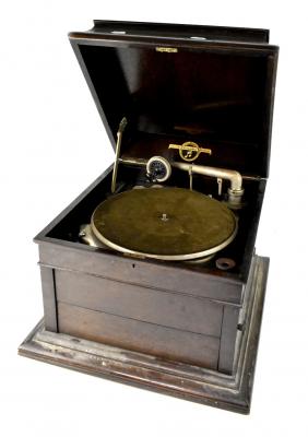 An early 20th century oak-cased Columbia Vivatonal wind-up gramophone, with spare Columbia needles, a Columbia fibre needle cutter, a small tin containing His Master's Voice gramophone needles and a record cleaner, also a large quantity of 78rpm records.