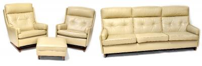 A 1960s three-piece suite comprising a three-seat settee, length 214cm, a pair of rocking chairs and matching footstool, button back upholstered in beige leatherette, on square bases (4).