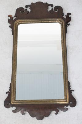 A 19th century mahogany fretwork and gilded wall hanging mirror, length 94cm (af).