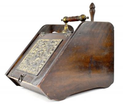 A late 19th/early 20th century mahogany purdonium with brass mounts and inlaid pressed floral and leaf pattern panel, fitted with a shovel.