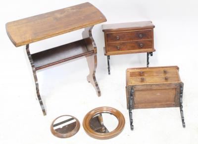 A pair of early 20th century mahogany two-drawer cabinets each with wrought iron wall mounts, 34 x 18cm, two mahogany framed circular mirrors and a mid-20th century mahogany rectangular table and combined magazine rack, 60 x 56cm (5).