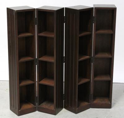 A contemporary stained pine four-fold metamorphic CD store designed as four hinged tower cabinets with triglyph fluted sides, height 95cm.