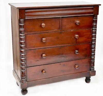 A Victorian mahogany Scottish chest of two short over three long graduated drawers, with cushion drawer above, flanked by pilasters, turned wooden handles, on ball feet, 129 x 125 x 51cm.