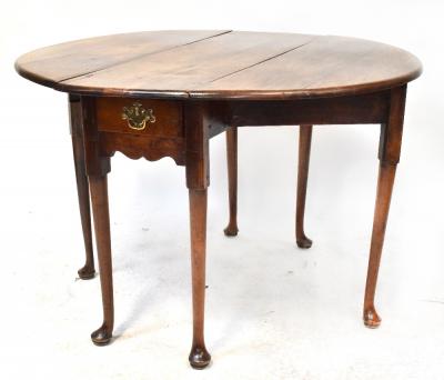 A George II walnut drop-leaf supper table with oval top, with single frieze drawer, on turned tapering legs with pad feet, height 72cm, width 106cm, length when extended 115cm.
