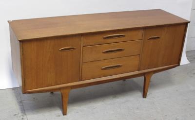 A 1970s Scandinavian-style teak sideboard, the central bank of three drawers flanked on either side by a cupboard supported on tapering legs to chromed pad feet, width 152.5cm.