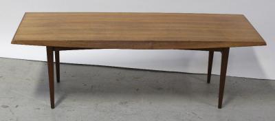 A 1970s vintage rectangular walnut coffee table on turned tapering legs, Gordon Russell label below, length 122cm.