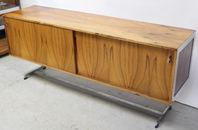 Merrow Associates; a mid-20th century rosewood and chrome sideboard, possibly by Richard Young, two sliding doors, chrome frame and handles to chrome supports, 65 x 183cm.  CITES certificate no.577466/01