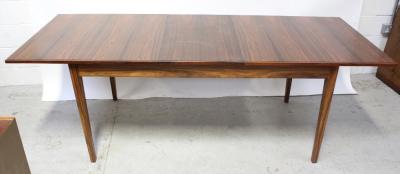 A mid-20th century rosewood veneer extending rectangular dining table on tapering supports, length when extended 216cm. CITES certificate number 577873/01
