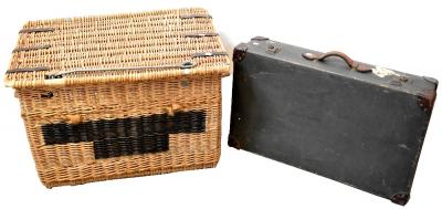A very large wicker lidded basket, 57 x 88 x 60cm and a leather-bound canvas suitcase inscribed 'J.M.C.L.', 50 x 85 x 21cm (2).
