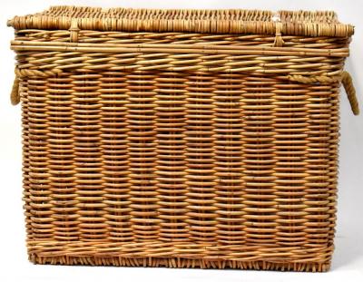 A very large modern wicker basket with heavy rope twist handles, the lid secured with leather straps, 64 x 67 x 88cm.