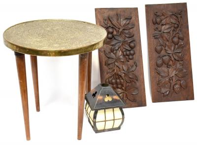 A small brass-topped Middle Eastern side table with later added tapered legs, height 39cm, diameter 38cm, two carved panels, one carved with berries and leaves, the other with strawberries and vines, each 45 x 20cm, also a pierced metal lantern shade (4).