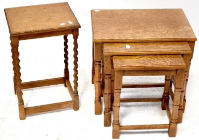 A nest of three oak side tables on turned supports to block feet, largest 45 x 49 x 34cm.