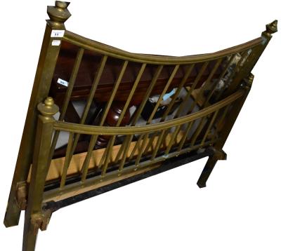 A late 19th/early 20th century brass bedstead with curved top rail, square section supports terminating in urn finials, width suitable for mattress 6'2'' x 4' wide.