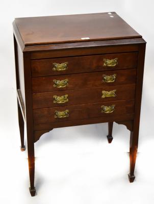 An Edwardian mahogany four-drawer music/document cabinet to tapering supports and peg feet, 90 x 60 x 46cm, and a 19th century oak stick back chair with rush seat (2).