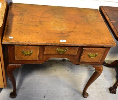 A George III and later oak lowboy, the crossbanded top above three drawers, raised on cabriole legs to pad feet, 71 x 76 x 46cm (af).
