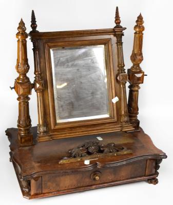 A late 19th century walnut Continental swing frame toilet mirror, with rectangular bevelled plate, flanked by pair of acanthus leaf decorated uprights, above an inlaid and crossbanded serpentine shaped base, with a single drawer, with further decorative inlay and raised on paw feet, 62 x 53 x 35cm (af).
