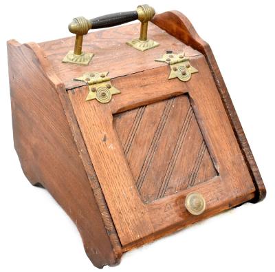 A Victorian and later oak coal scuttle with brass handle and hinges, with tin liner, 33 x 31 x 39cm (af).