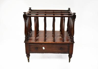 A 19th century mahogany Canterbury, the sectioned top with slender turned supports, the corners surmounted by knops, on a base with a single frieze drawer and on turned fluted tapering legs on brass castors, 53 x 50 x 34cm.