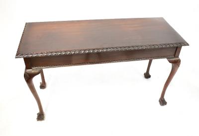 A 19th century mahogany side table, the rectangular top with gadrooned borders, on cabriole legs with ball and claw feet, 74 x 123 x 46.5cm.