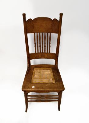 Four various 19th and 20th century chairs, including a 19th century mahogany bergère seated dining chair, on turned tapering legs, a French 19th century walnut bedroom chair with bergère back rest and seat, on slender carved cabriole legs, one other rush seated kitchen chair and a carved kitchen chair with spindle back rest and bergère seat, on turned tapering legs (4).
