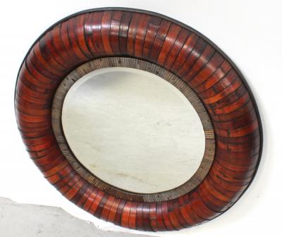 A round bamboo-framed sectional wall mirror, diameter 68cm.