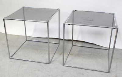 A pair of chrome tubular steel glass-topped cube tables, height of each 48cm (2).