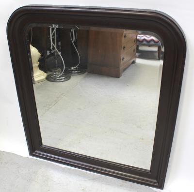 A large stained mahogany bevel-edge arch-topped pier mirror with cushion frame, approx height 103cm.