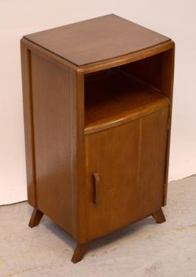An early-to-mid 20th century oak bedside cabinet in the Utility style with single bookshelf over pot cupboard base, on splayed legs, height 77cm.