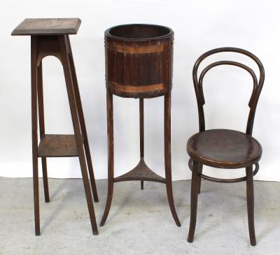 An early 20th century oak coopered planter on tripartite outswept legs united by a shelf stretcher, a plain oak torchère on square legs with shelf stretcher, height 104cm and a Michael Thonet style bentwood café chair with pressed plywood seat (3).