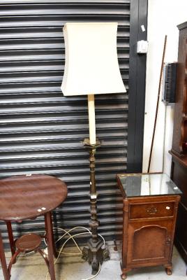 A brass-effect Baroque style torchère converted to a standard lamp, raised on three scroll feet, height 140cm.