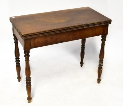 A late 19th century mahogany rectangular topped fold-over card table on turned tapering legs, 74 x 85 x 42.5cm.