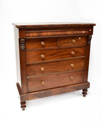 A Victorian mahogany Scottish chest of two short over three long drawers with a cushion drawer above the two short drawers, turned wooden handles, on turned bottle feet, 151 x 138 x 54cm.