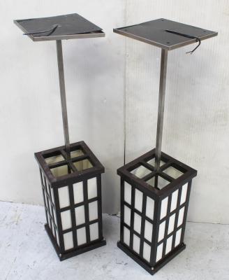 A pair of pendant lantern-style Proto-Modernist lanterns, on square section brushed steel rods, height of each 99.5cm (2).