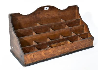 An oak waterfall vertical pigeonhole desk tidy/organiser with four rows of pigeonhole compartments, 31 x 64 x 28cm.