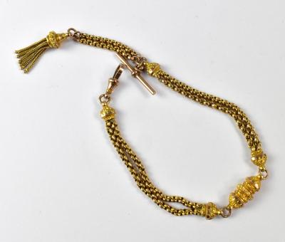 A 9ct gold fob chain in two sections, each with a pair of belcher links chains linked with a hollow oval engraved ornate sectional piece, one link with a octagonal T-bar, one end with lobster catch, another with a tasseled pendant, stamped 9ct, length 28.5cm, approx 16.6g.
