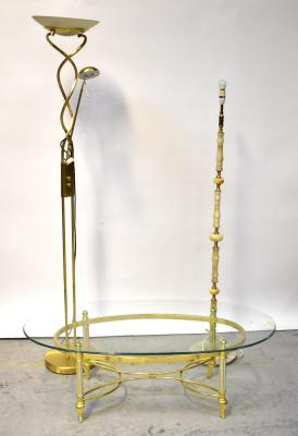 A modern oval glass-topped coffee table on brass plated Classical-style frame, 42 x 124 x 63cm, together with two standard lamps, one modern with up-lighter and adjustable reading attachment, the other turned onyx, height 158cm (3).